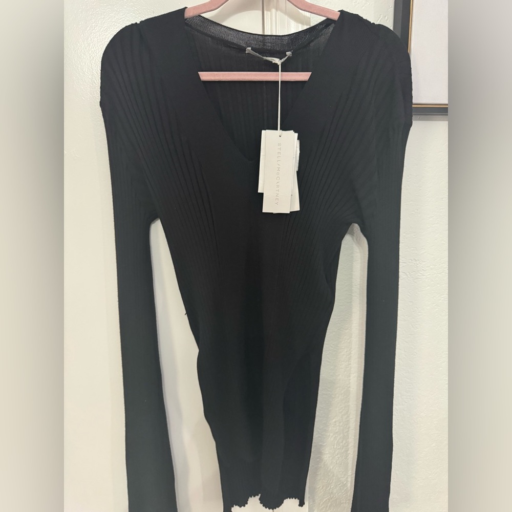 Stella McCartney
rib-knit long-sleeve top Black 

•  83% viscose, 17% polyester